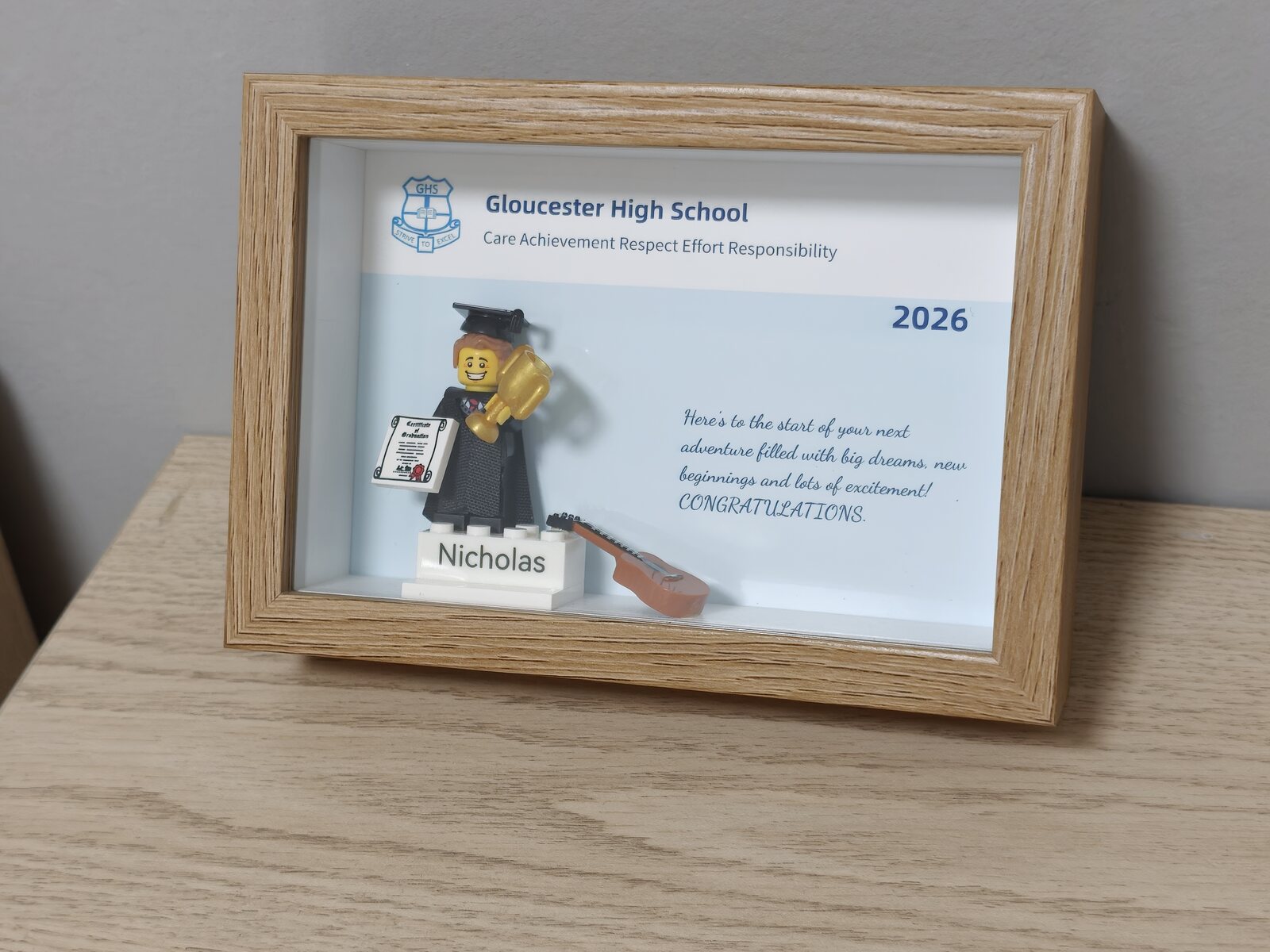 Completed personalised graduation order in an oak frame